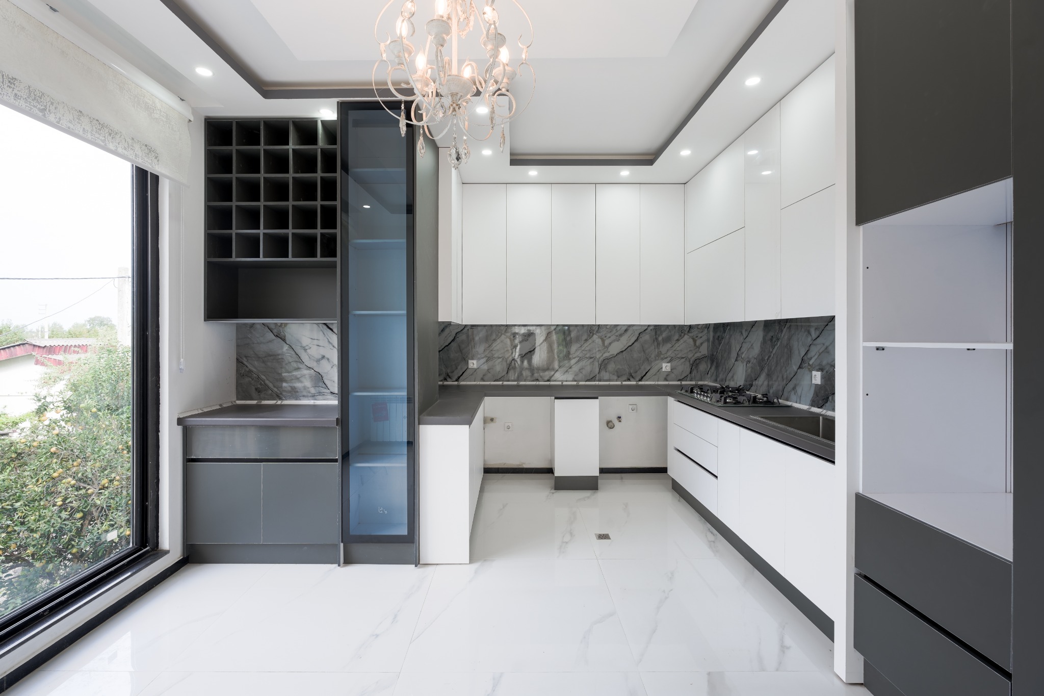 White and charcoal contemporary kitchen wide view