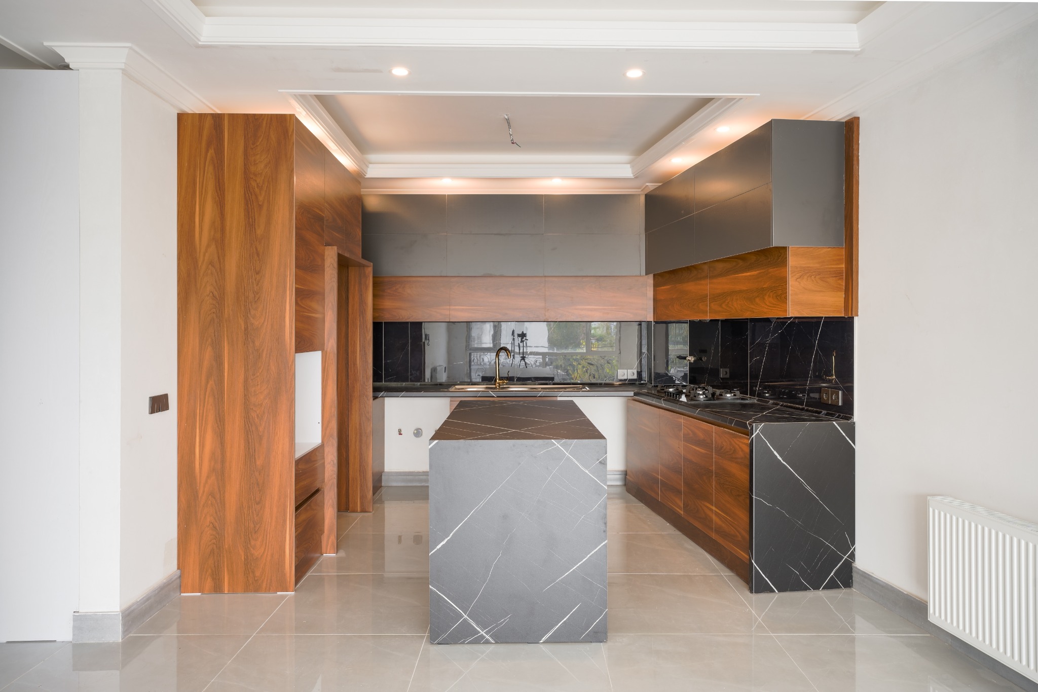 Walnut and black stone kitchen wide view