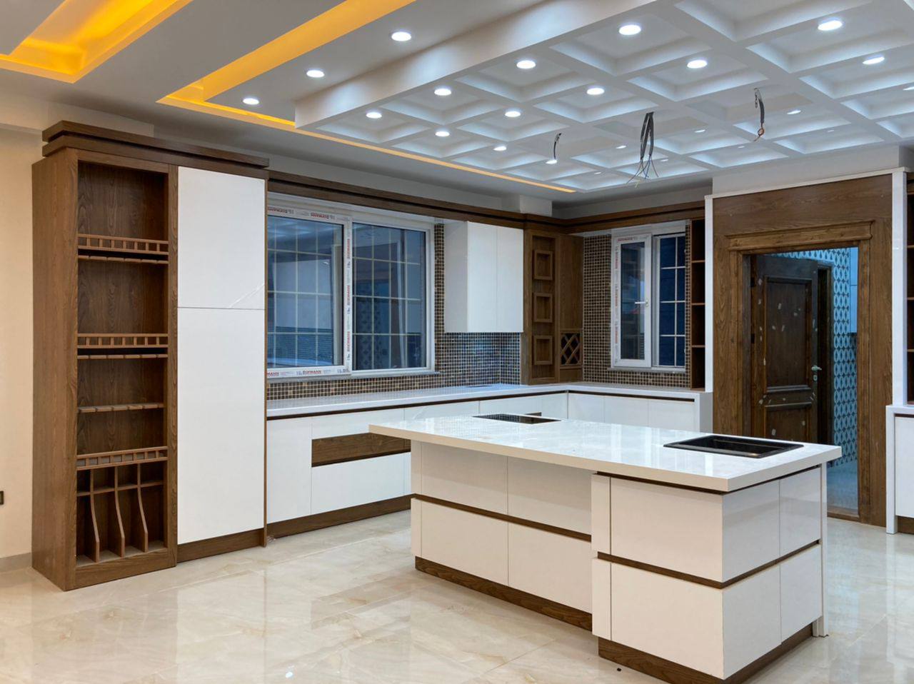 White and walnut kitchen with large island
